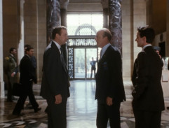 Frank talks with colleagues